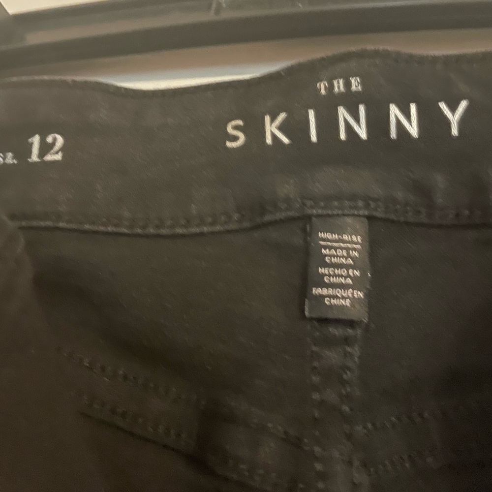 WHBM Black Skinny Jeans rips with shimmer